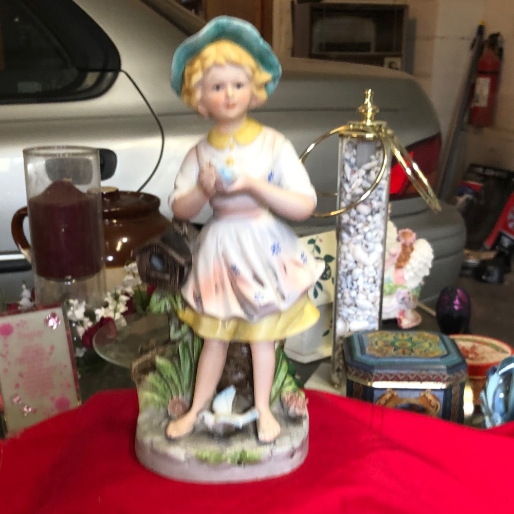 Charming Porcelain Figurine with Blue Hat